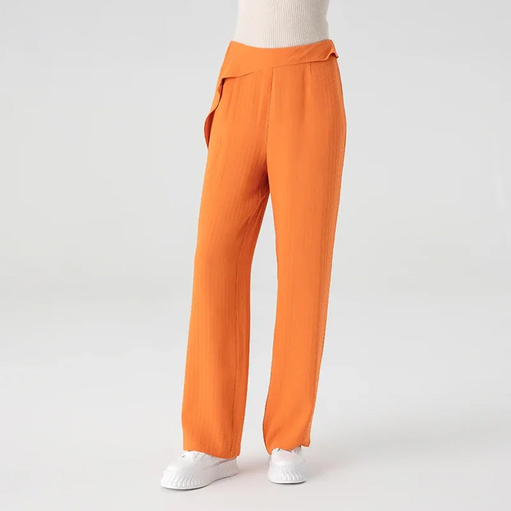 Women's High-density 44 momme Mulberry silk jacquard tapered trousers in Fragrant Cloud. Featuring an asymmetrical waist overlay sculpted with a single fixed pleat. — From Borcelleclothes.