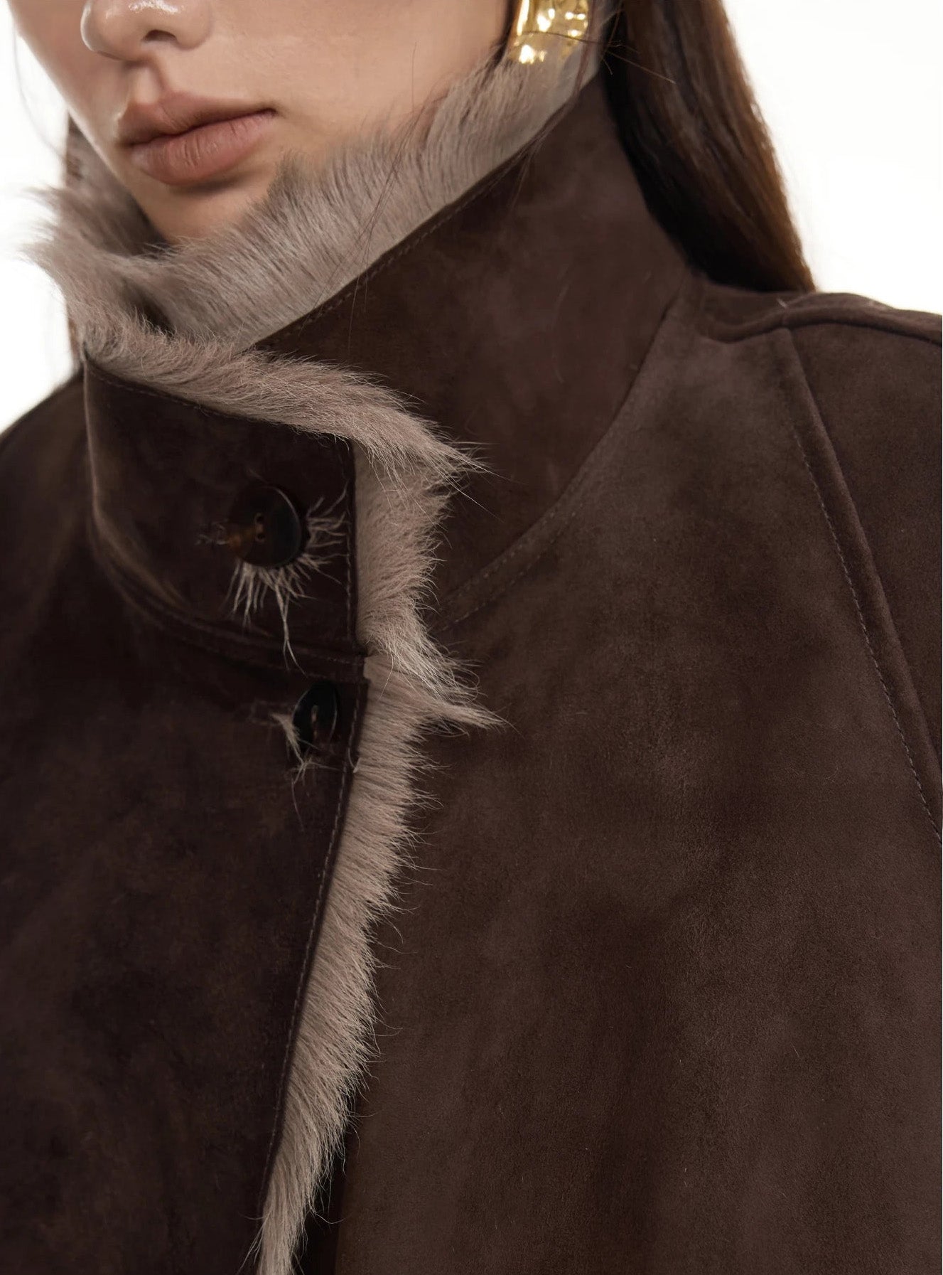 Upper part of suede-faced goatskin jacket in Toorak, fastened with visible horn buttons — From Borcelleclothes.