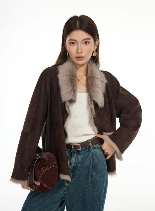 Woman wearing suede-faced goatskin jacket in Toorak, unfastened, hand resting on hip — From Borcelleclothes.