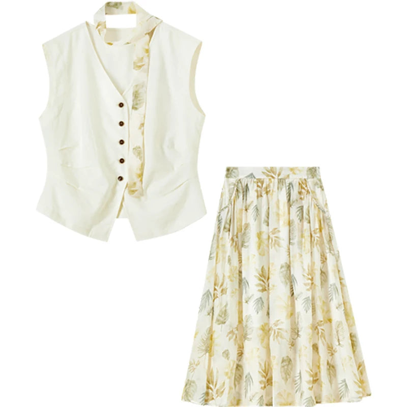 Flat lay of the Sydney Breeze set including the vest, chiffon skirt, and the matching botanical print neck tie — From Borcelleclothes.