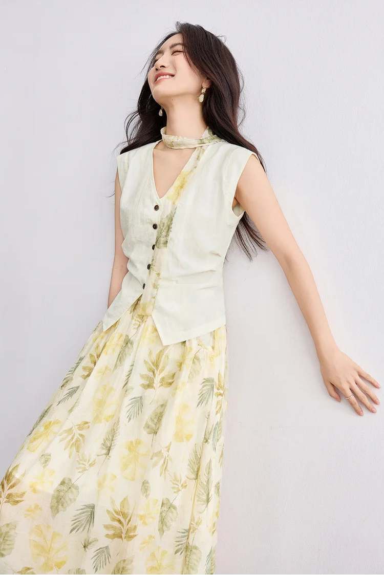 A smiling woman in the Sydney Breeze set leaning against a wall, showcasing the relaxed elegance of the ensemble — From Borcelleclothes.