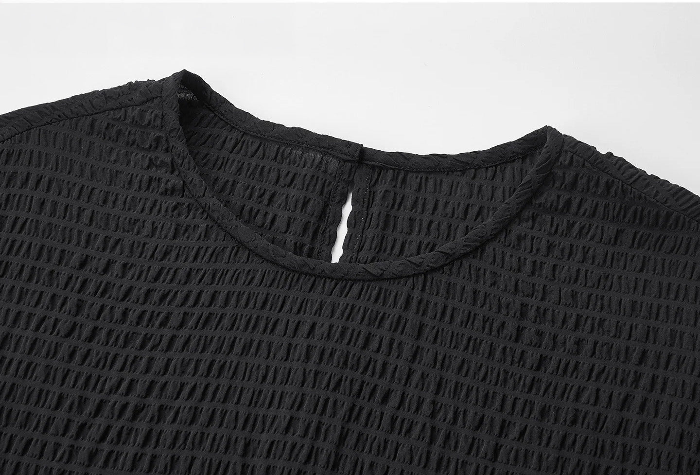 Close-up of the modest round neckline on a black textured Mulberry silk blouse — From Borcelleclothes.