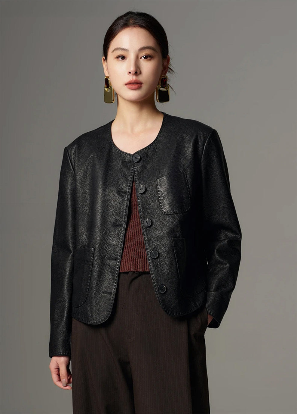 Front portrait of the model looking at the camera in the Calculated Tension goatskin jacket — From Borcelleclothes.