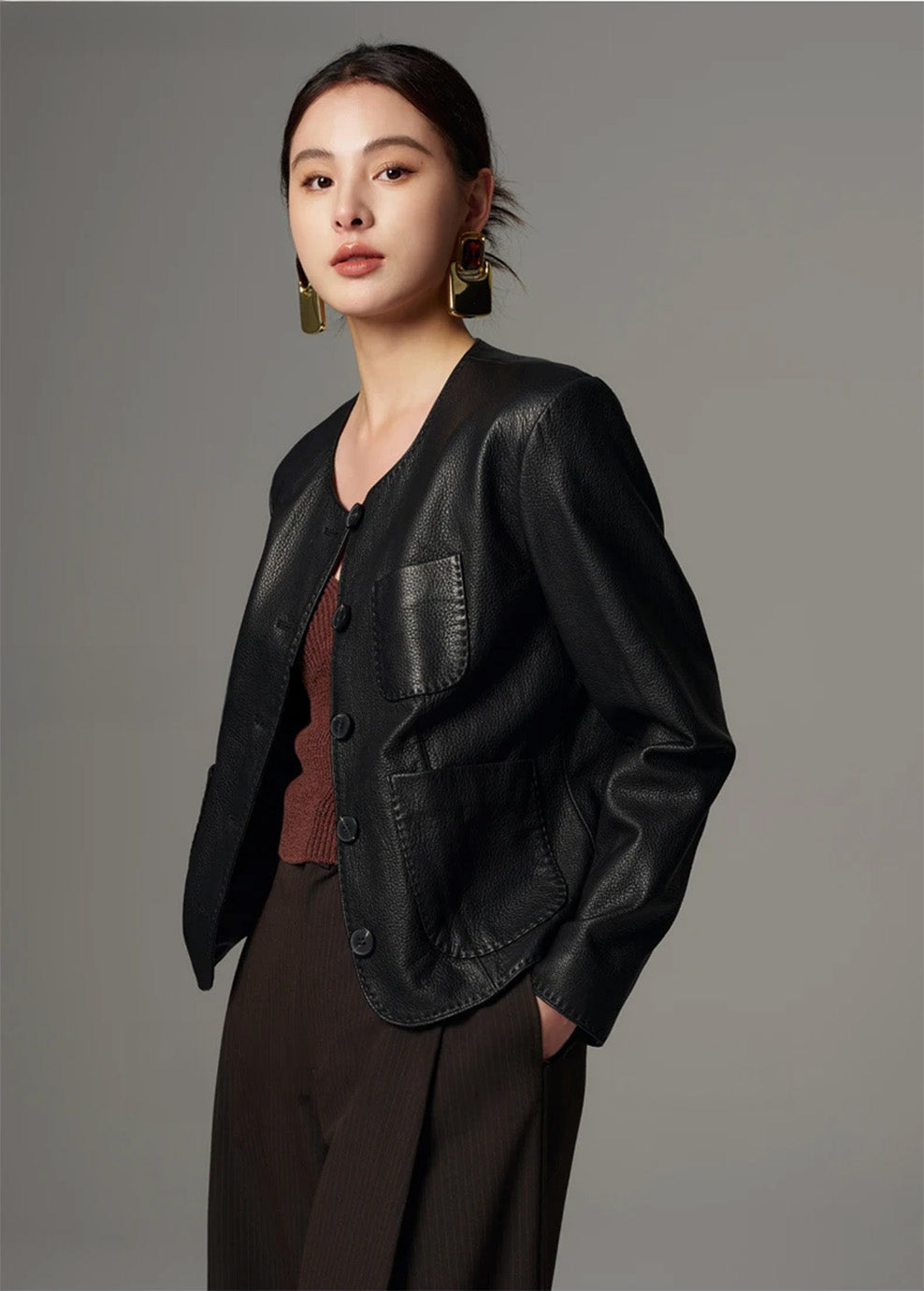 Side profile view of the architectural semi-fitted cropped goatskin jacket — From Borcelleclothes.