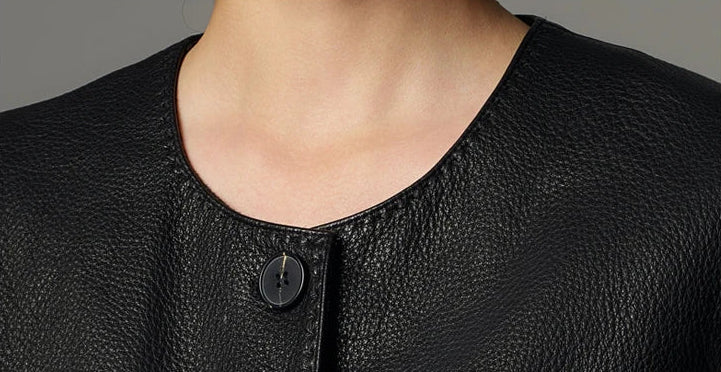 Detailed close-up of the clean scoop neckline and heavy-gauge double topstitching — From Borcelleclothes.