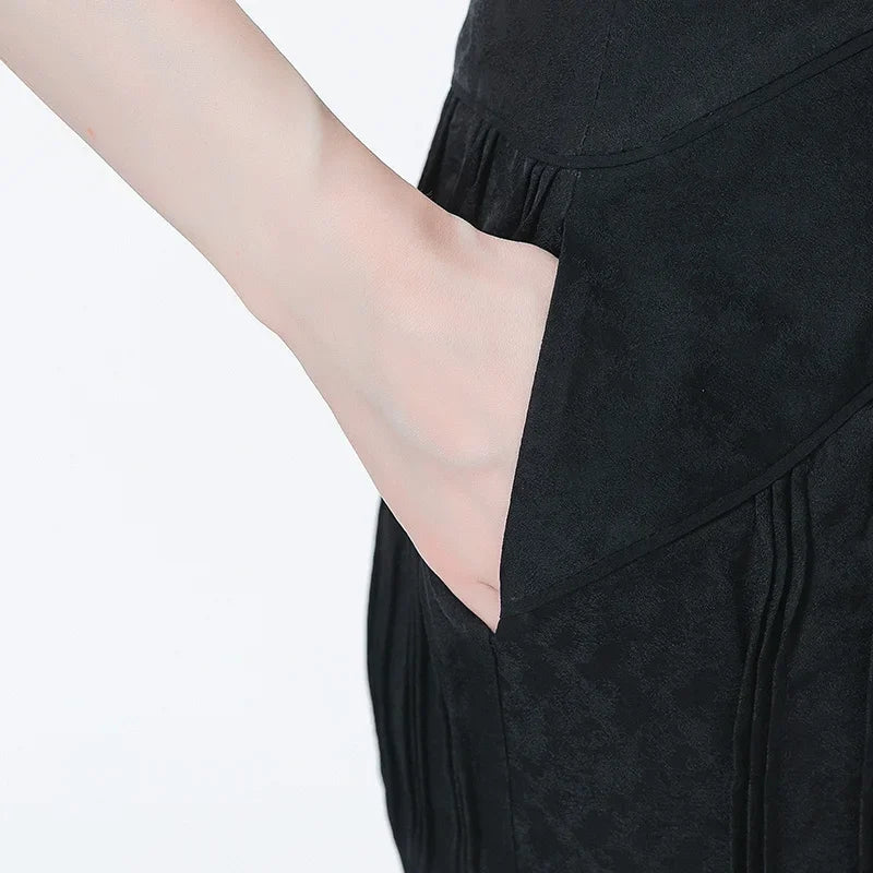 Close-up of model’s hand in the side seam pocket of Hide-and-Seek silk trousers — From Borcelleclothes.