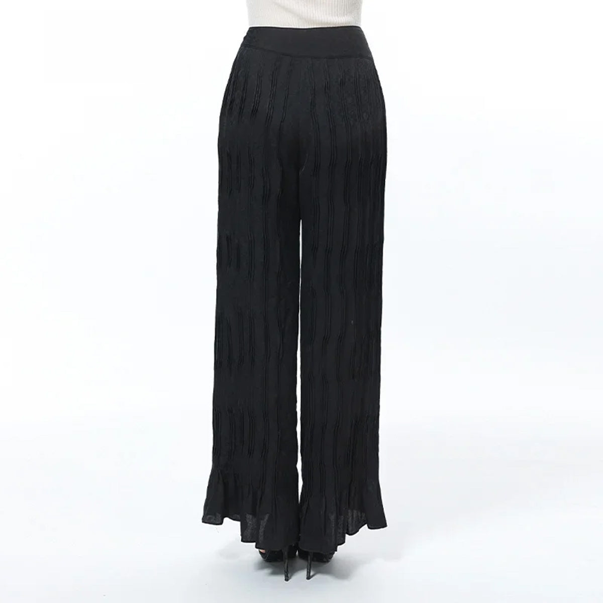 Back view of Hide-and-Seek silk trousers showing the smooth waistline and fluid drape — From Borcelleclothes.