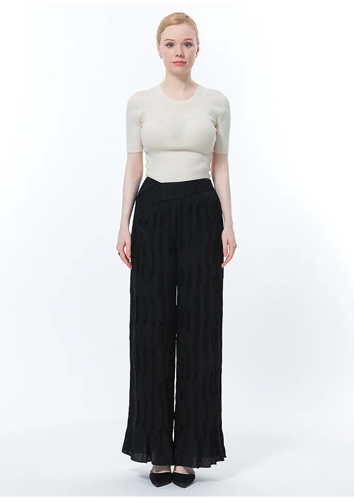 Full-length front view of wide-leg silk trousers in Hide-and-Seek on model standing straight — From Borcelleclothes.