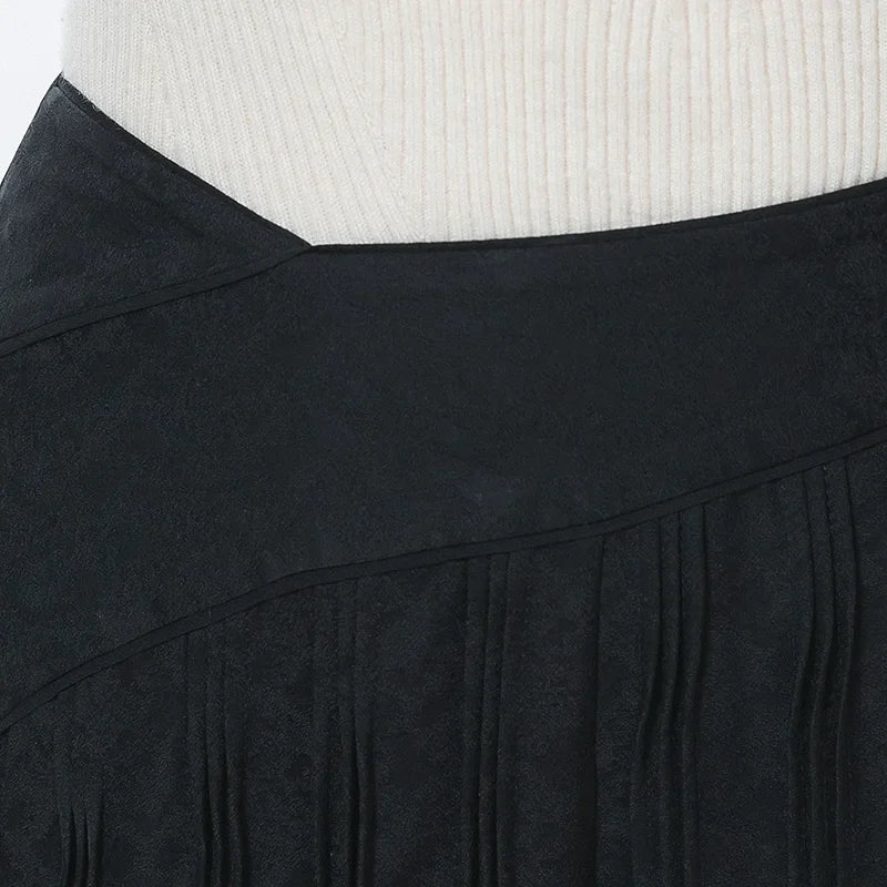 Close-up of the right waist section showing the high-low curved yoke detail and topstitching — From Borcelleclothes.