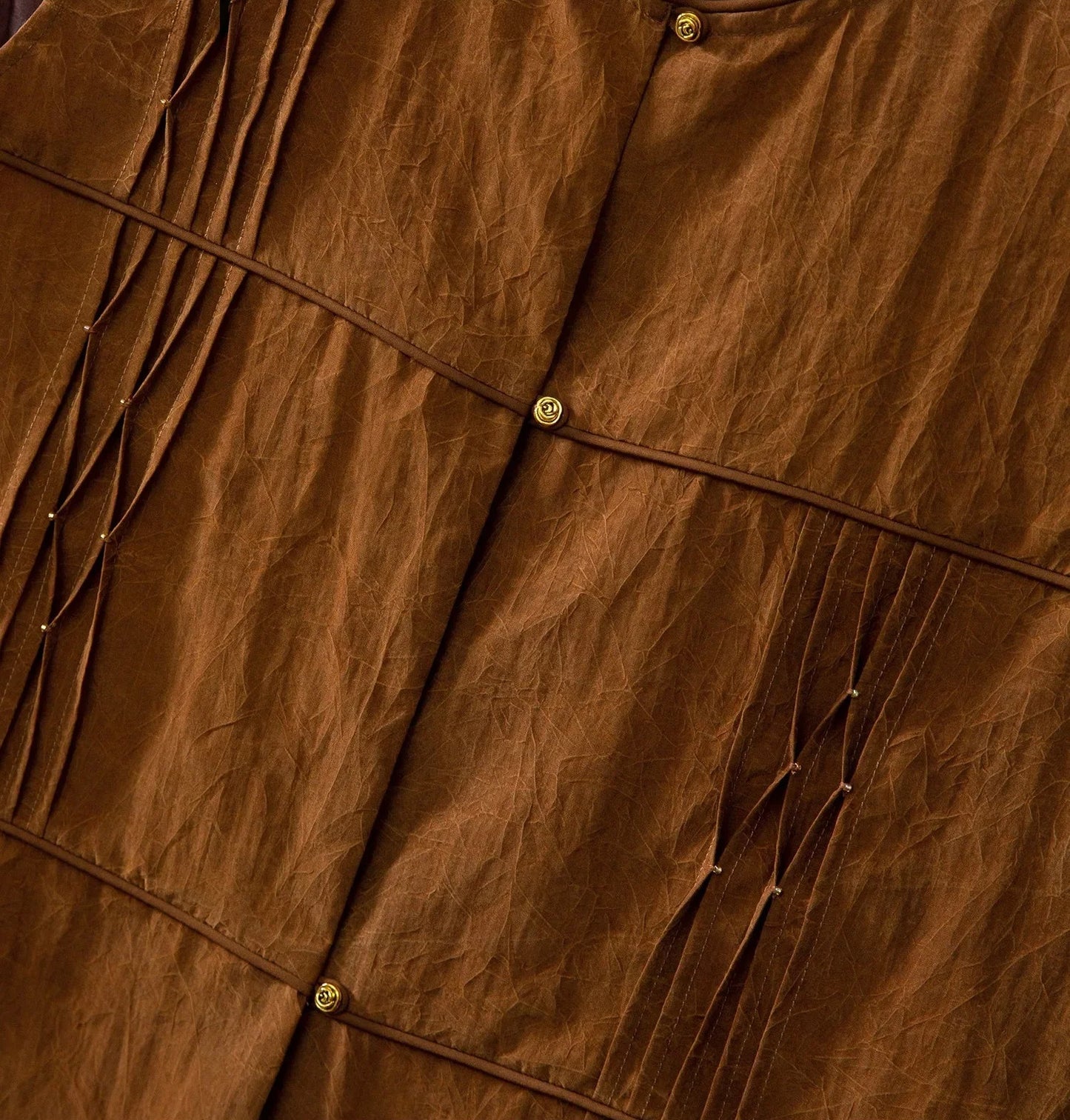 Middle front detail of Tucked Xiangyunsha Silk Blouse in Cinnamon Amulet with gold bead accents — From Borcelleclothes.