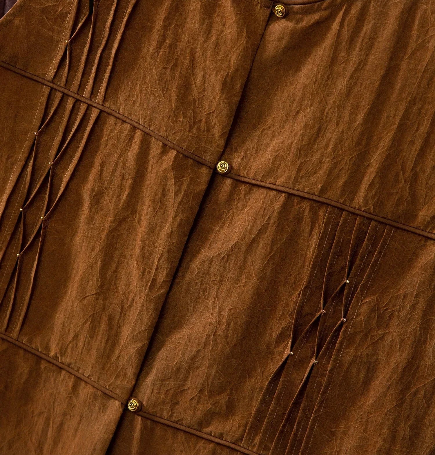 Middle front detail of Tucked Xiangyunsha Silk Blouse in Cinnamon Amulet with gold bead accents — From Borcelleclothes.