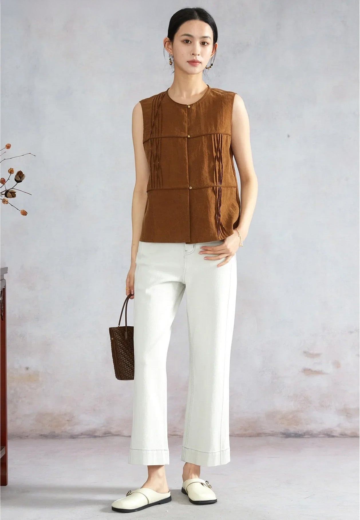 Women’s Tucked Xiangyunsha Silk Blouse in Cinnamon Amulet styled on model with thumb in pocket — From Borcelleclothes.