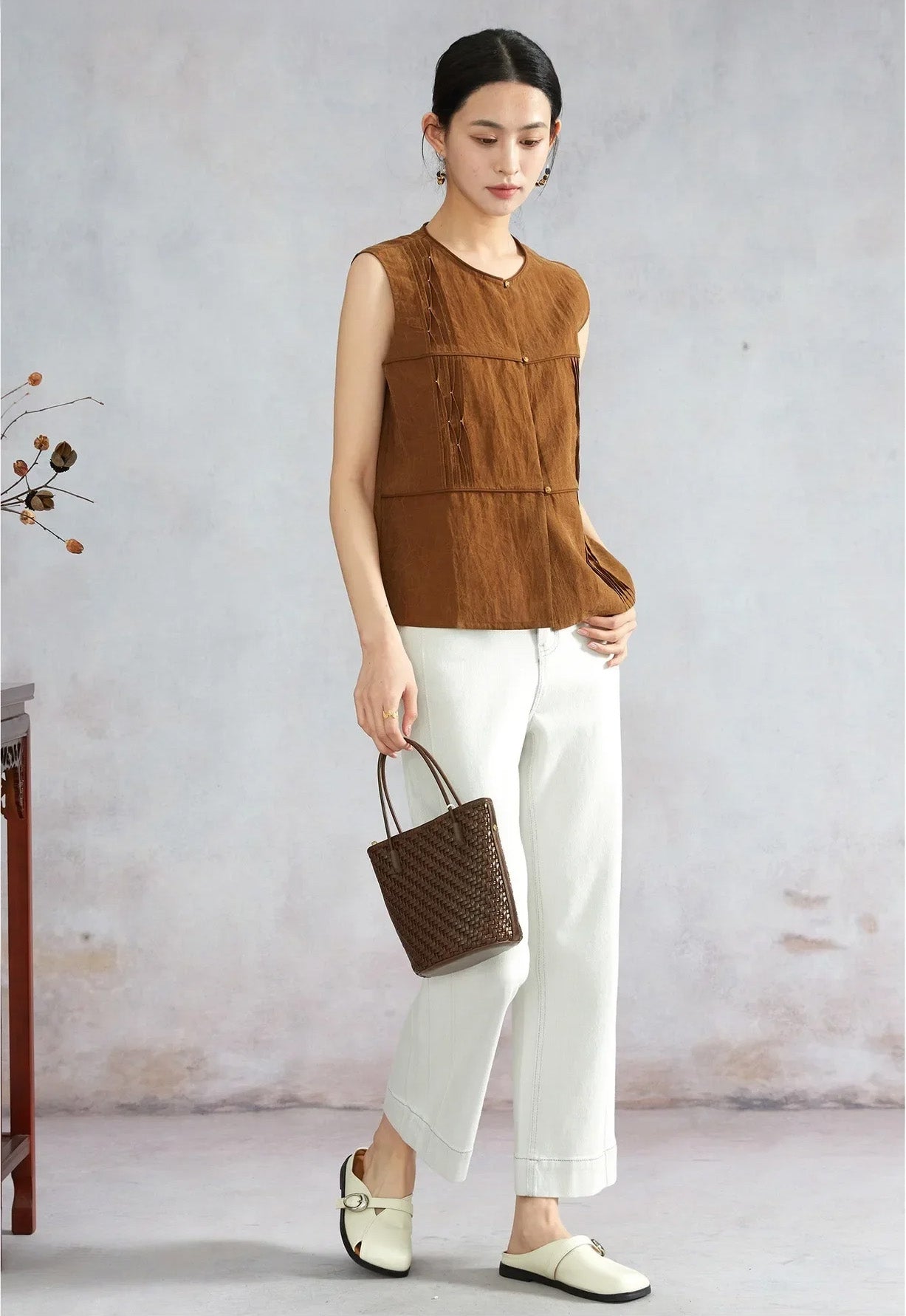 Side view of model walking in Tucked Xiangyunsha Mulberry Silk Blouse in Cinnamon Amulet — From Borcelleclothes.