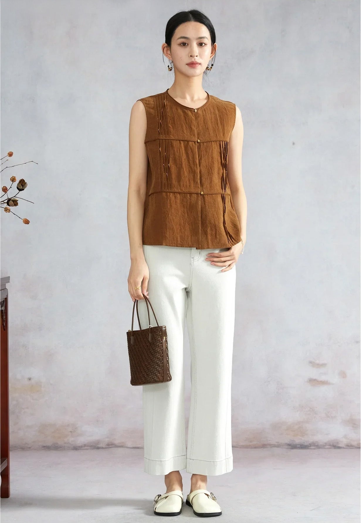 Full-length view of model posing in Tucked Xiangyunsha Mulberry Silk Blouse in Cinnamon Amulet — From Borcelleclothes.