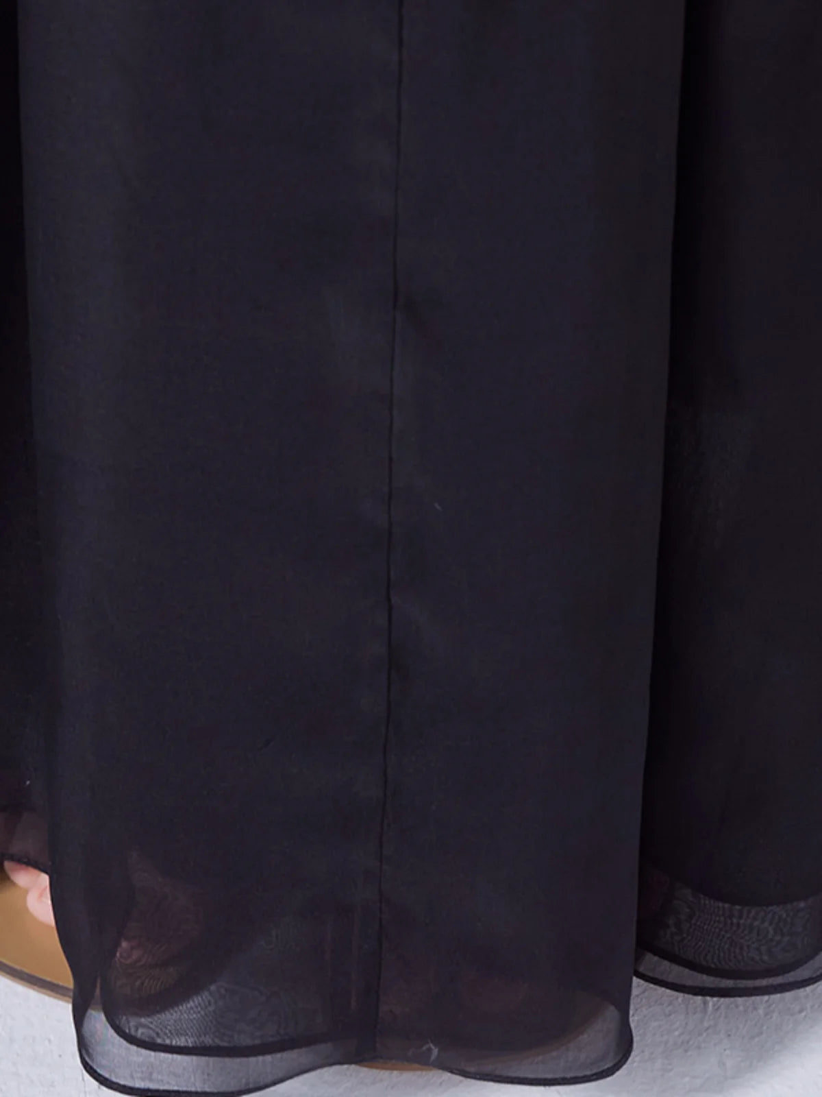 Detailed close-up of the two-layer bottom hem on pleated Mulberry silk chiffon maxi skirt — From Borcelleclothes.