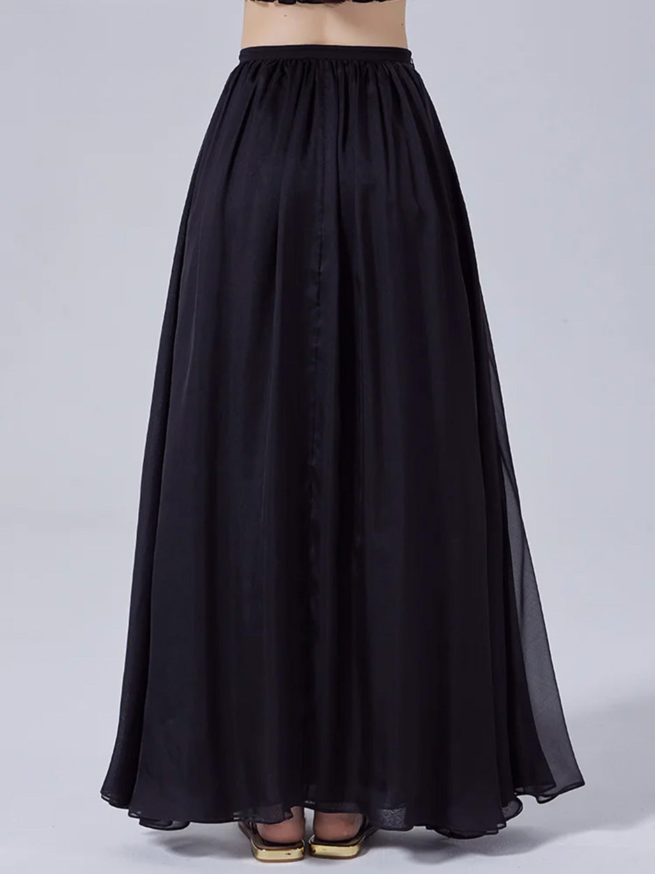 Back view of model wearing women's pleated Mulberry silk chiffon skirt — From Borcelleclothes.
