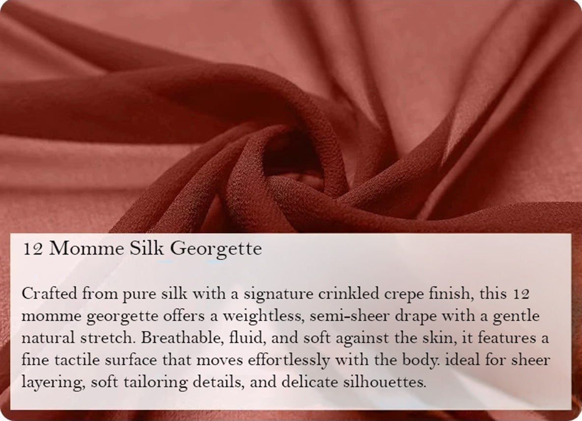 Close-up of spiral-folded texture on two-layer pleated Mulberry silk georgette trousers in Contradictory Terracotta — From Borcelleclothes.