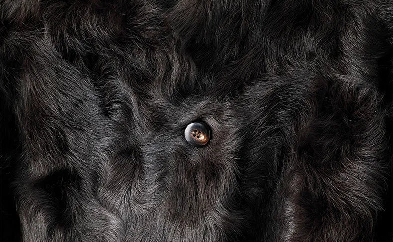 Horn button detail on the Henna Glow V-neckline shearling coat — From Borcelleclothes.
