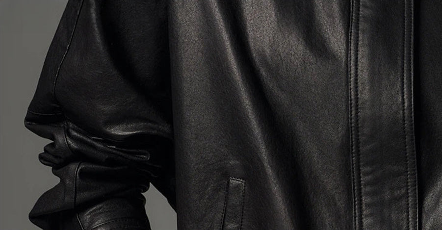 Detailed view of the tapering kimono sleeve, showing the supple drape and artisan seam construction — From Borcelleclothes.