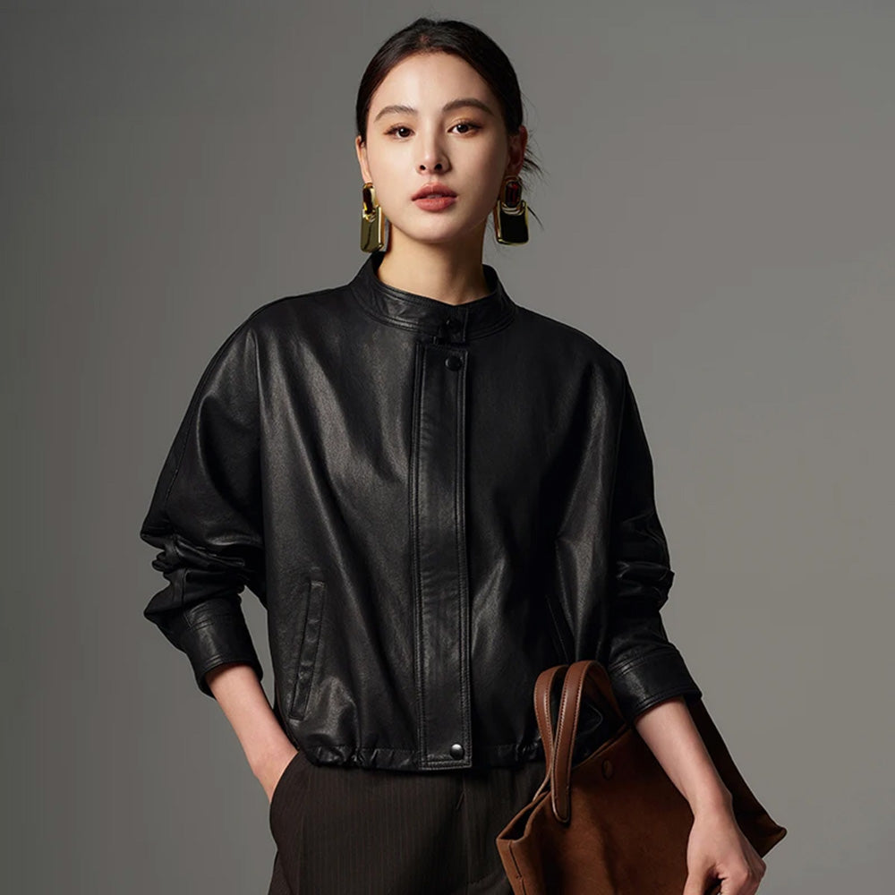 Women's Cropped artisan vegetable-tanned sheepskin jacket in Ti Guardo Adesso. Featuring a band collar, draped kimono sleeves, and side drawstrings. — From Borcelleclothes.