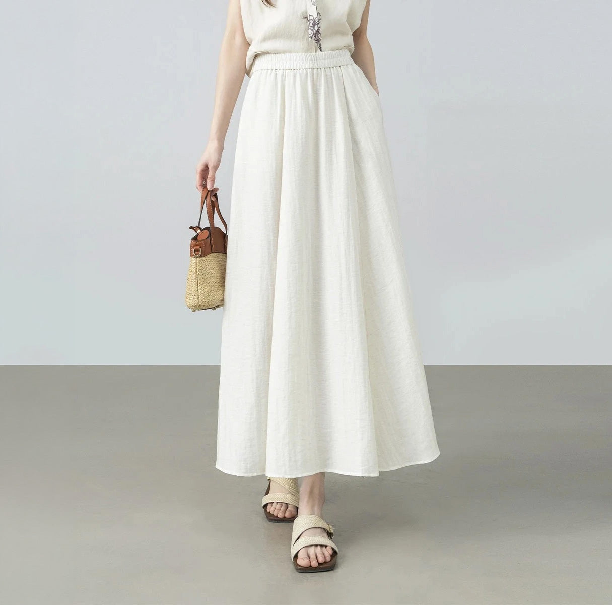 Women's midi viscose-linen blend gathered skirt with a crinkled texture in Azir Fog, featuring an elasticated waistband and side seam pockets. — From Borcelleclothes.