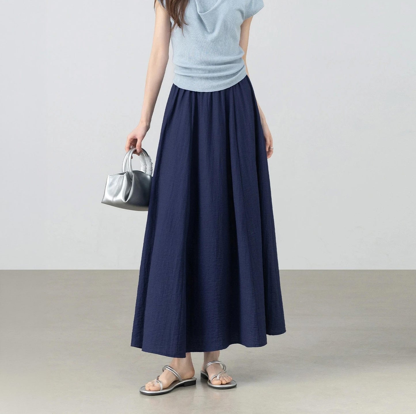 Women's midi viscose-linen blend gathered skirt with a crinkled texture in Shurima Oasis, featuring an elasticated waistband and side seam pockets. — From Borcelleclothes.