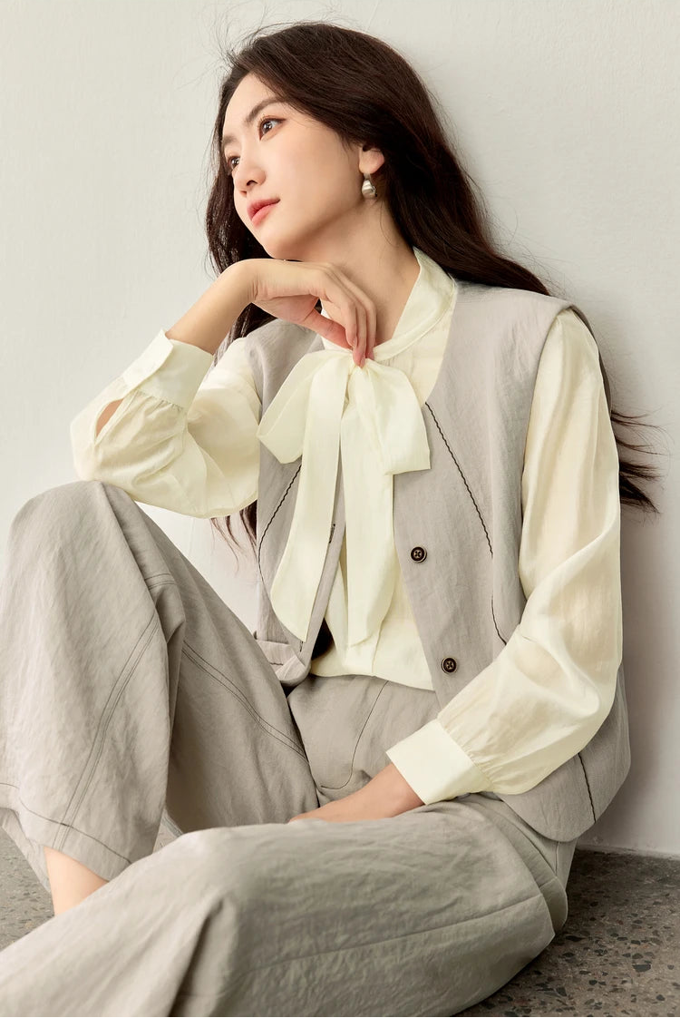 Relaxed moment: a woman sitting on the floor in her viscose blend set, emphasizing the soft drape of the fabric — From Borcelleclothes.