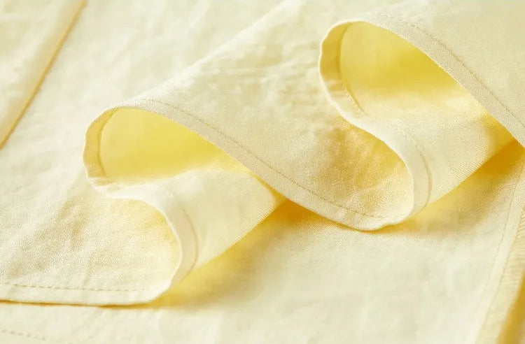 Close-up of the flared skirt hem, showing the high-quality stitching and the texture of the viscose fabric — From Borcelleclothes.