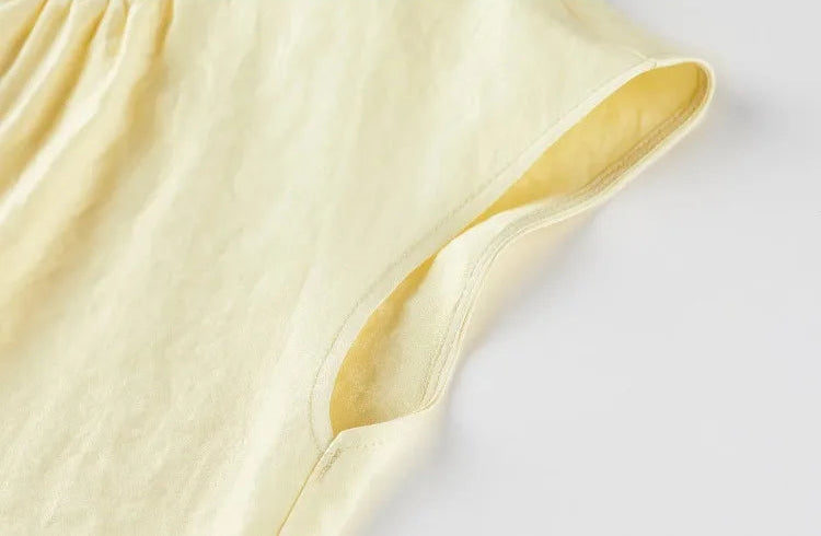 Detailed view of the deep armhole on the viscose top, designed for air circulation and freedom of movement — From Borcelleclothes.