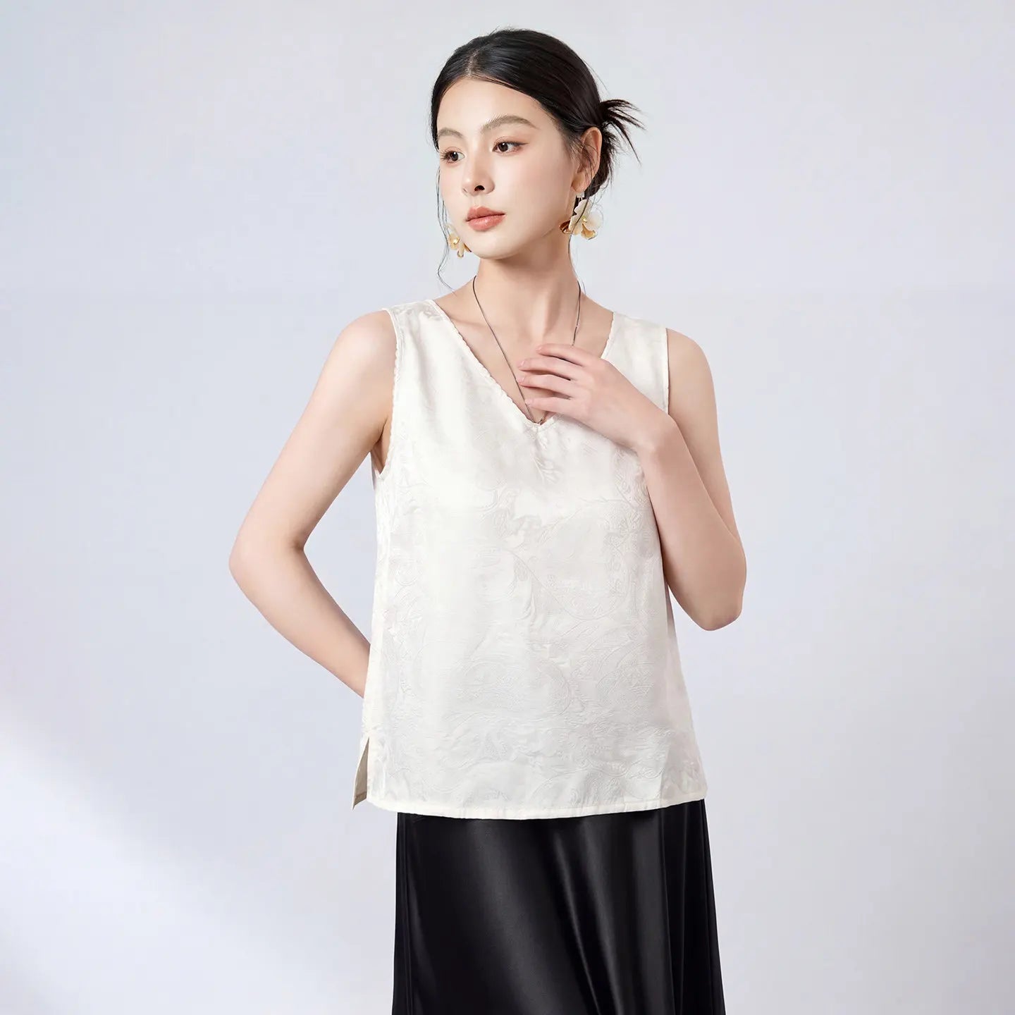 Women's Sleeveless 19 momme Sangbo silk jacquard top in Melting Ice Lace. Features delicate picot trim, dual V-necklines, and fluid drape. — From Borcelleclothes.