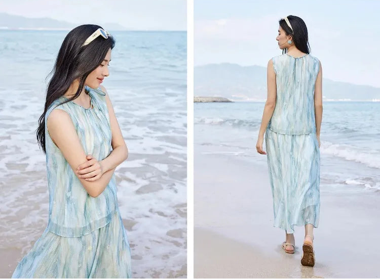 Front and back view of a woman wearing the flowy watercolor blue set by the ocean — From Borcelleclothes.