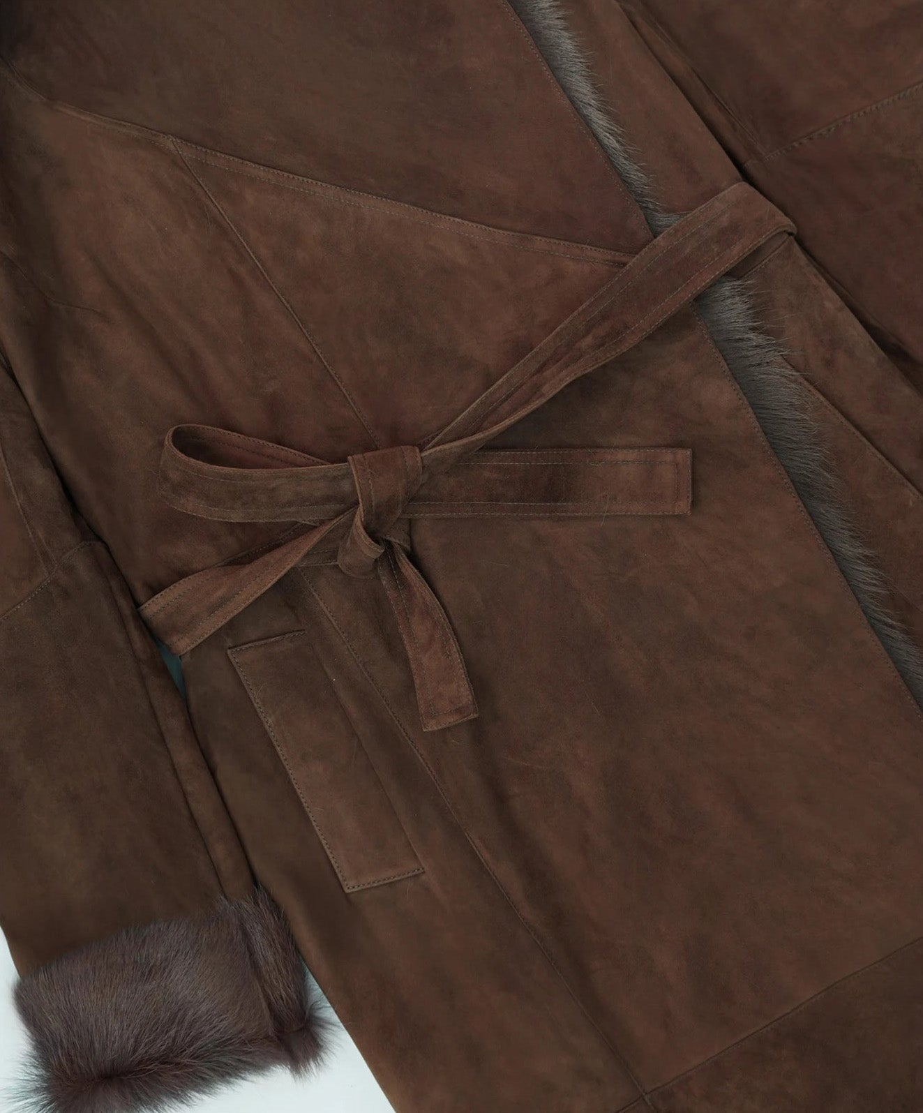 Belt tied in a knot on the Woodsy Brown double-faced goatskin coat, showing the coat’s adjustable fit — From Borcelleclothes.