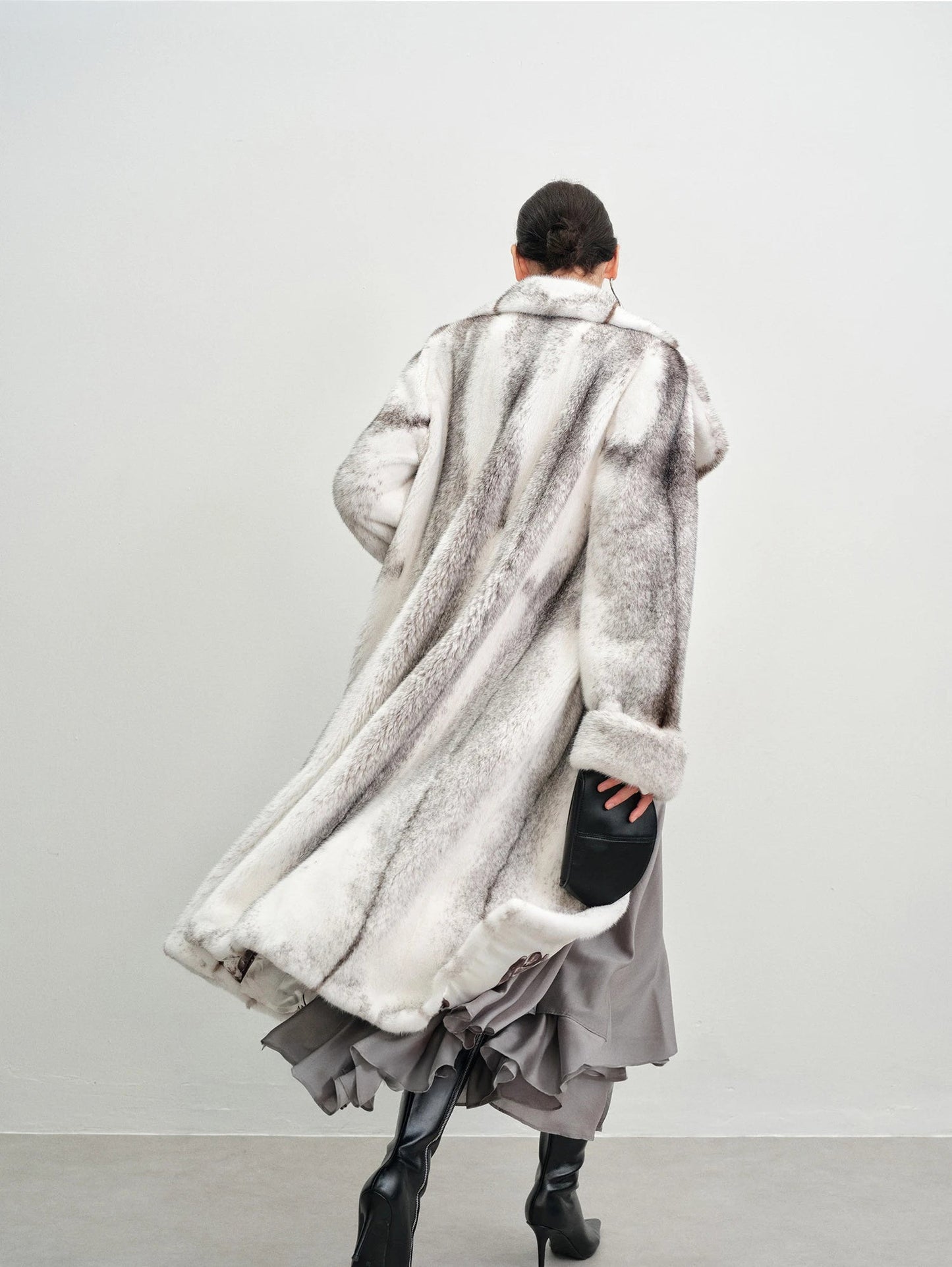 Back view of the model in the cross mink coat — From Borcelleclothes.