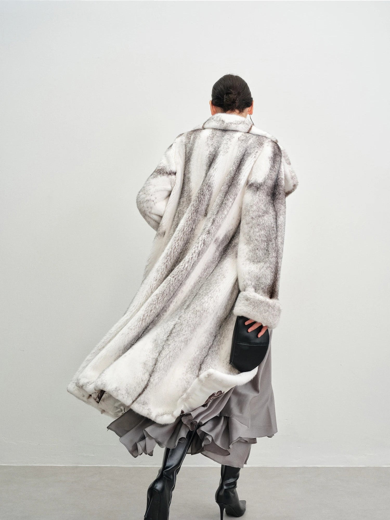 Back view of the model in the cross mink coat — From Borcelleclothes.