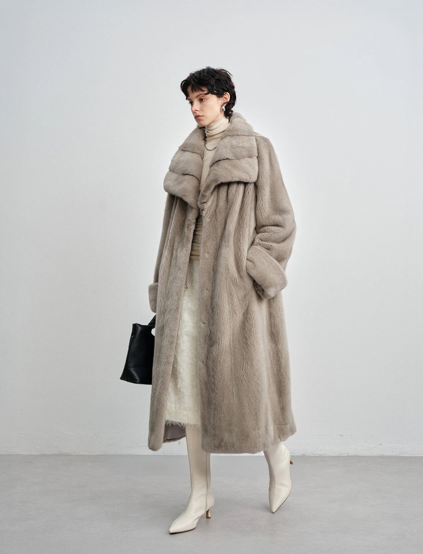 Model in motion wearing the silver blue mink coat — From Borcelleclothes.