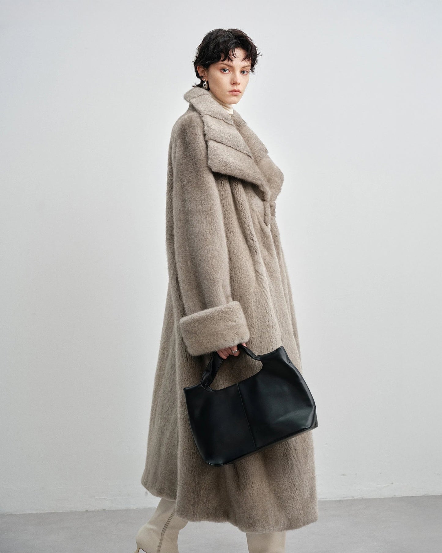 Side profile of the model in the silver blue mink coat — From Borcelleclothes.