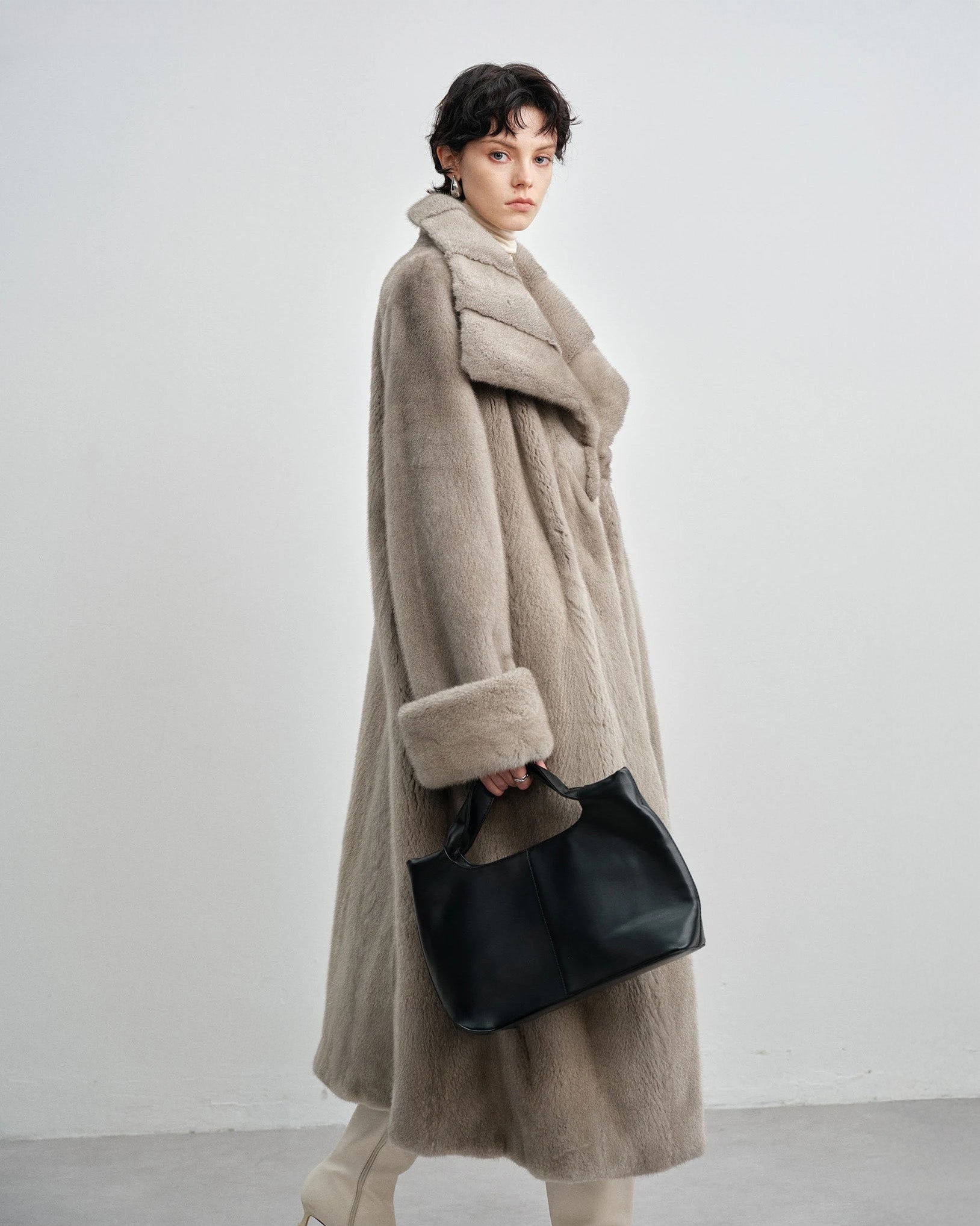 Side profile of the model in the silver blue mink coat — From Borcelleclothes.