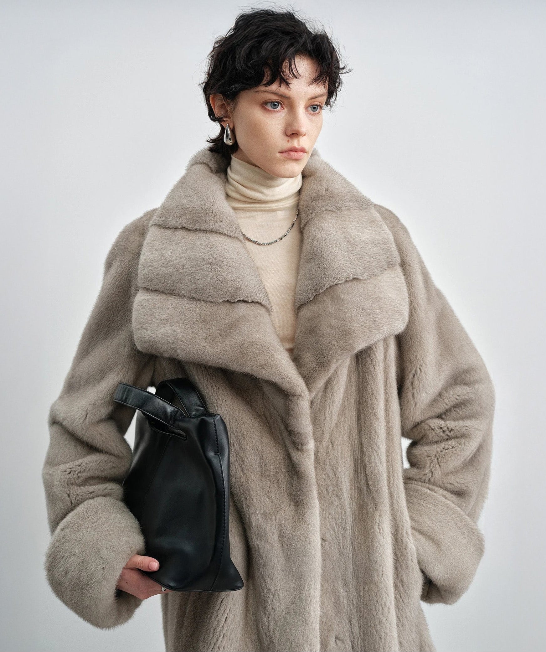 Upper body view of the model in the silver blue mink coat — From Borcelleclothes.