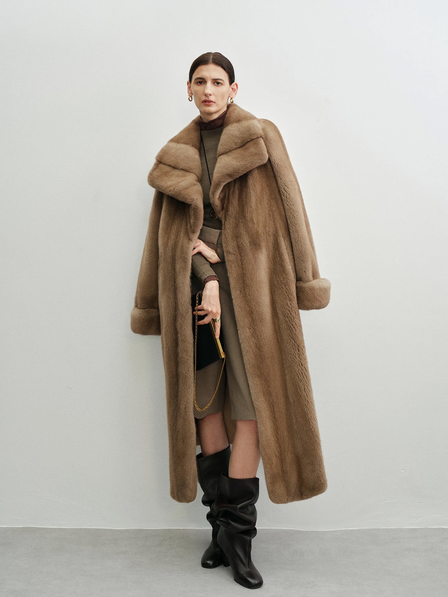 Model with the striped mink coat draped over one shoulder — From Borcelleclothes.