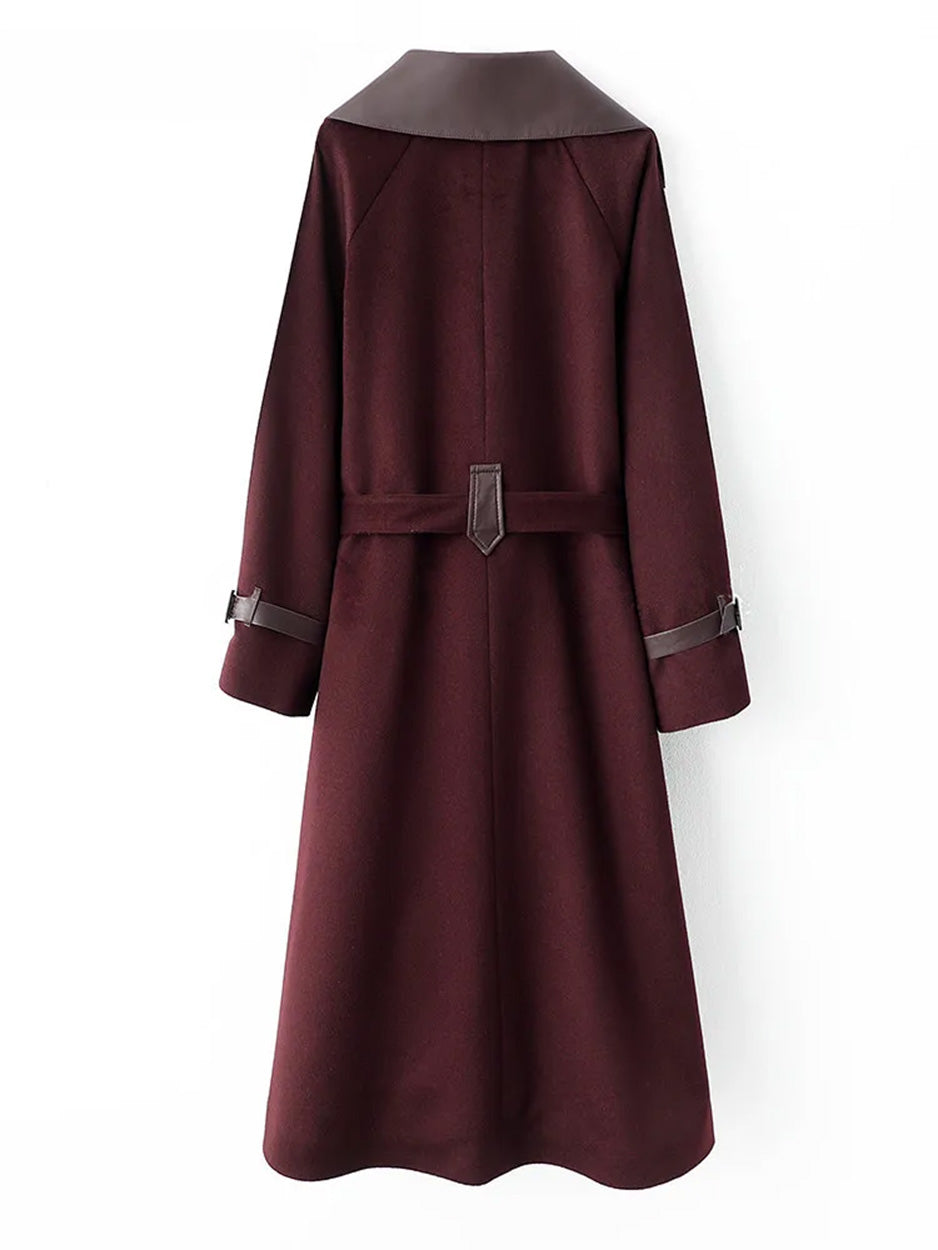 Professional flat lay of the coat's back, focusing on the decorative leather loop and the symmetry of the wool panels. From Borcelleclothes.