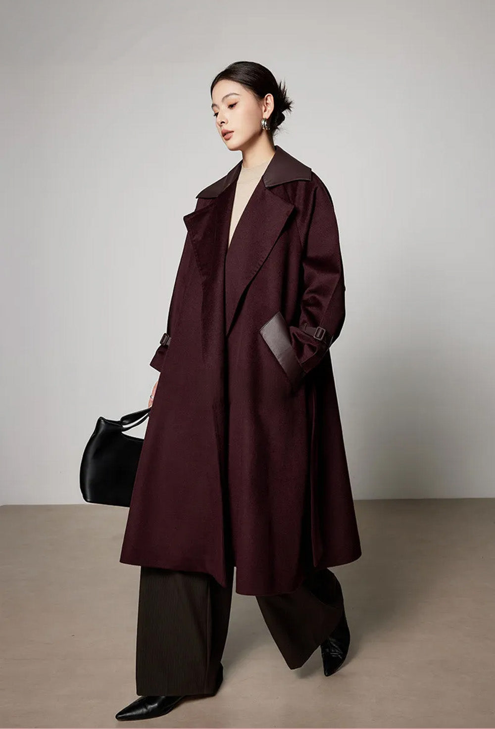Side profile of a model walking, demonstrating the "languid dynamics" and fluid movement of the flared hem. From Borcelleclothes.