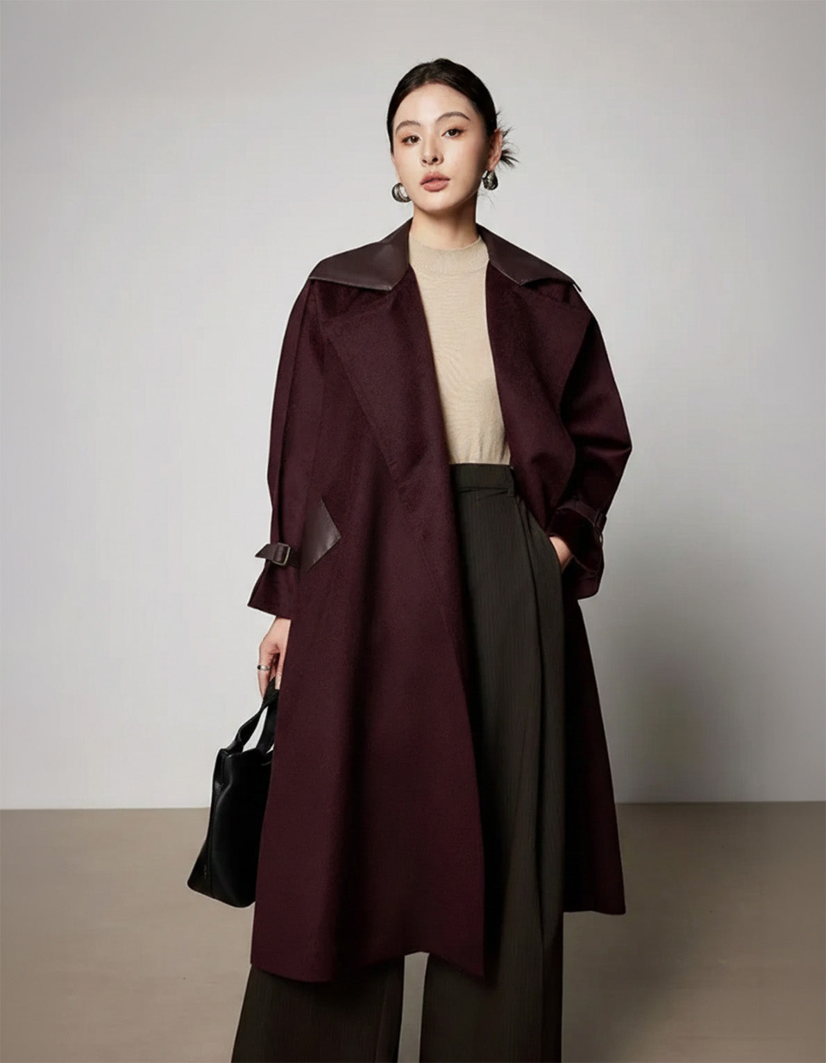 Women's wrap flared wool coat in deep Bordeaux with sheepskin upper collar and architectural cuff details. — From Borcelleclothes.