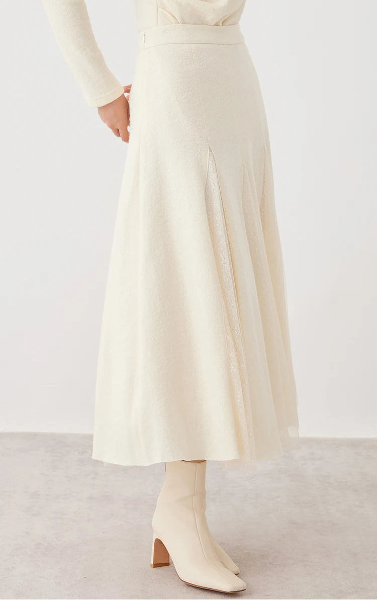 Side view of a model showcasing a women's wool godet skirt with sheer panels in Godet Summer — From Borcelleclothes.