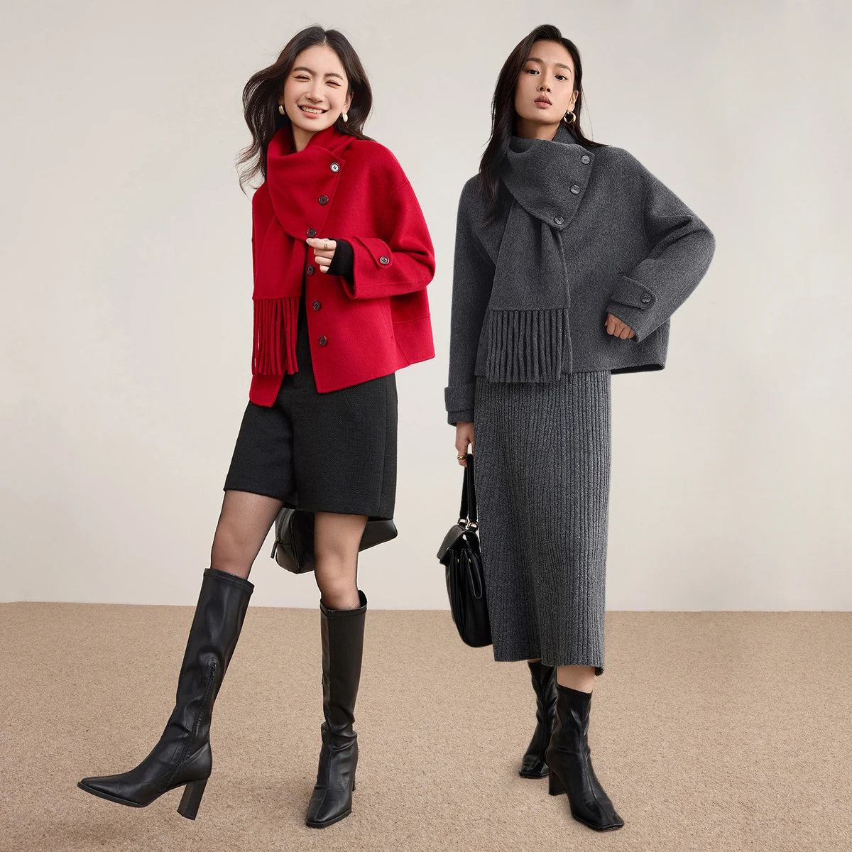 Two women posing together, showcasing the contrast between the Grey and Red wool jackets — From Borcelleclothes.