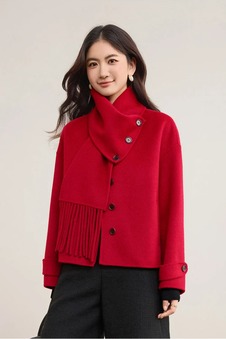 A woman standing tall in the Red wool jacket, showcasing its clean lines and bold color — From Borcelleclothes.