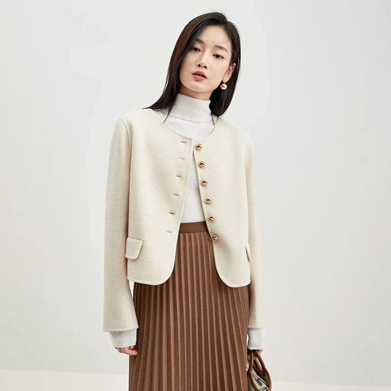 Women's collarless double-sided wool jacket in Echo of Jazz color, with sculptural golden buttons and hand-finished seams. — From Borcelleclothes.