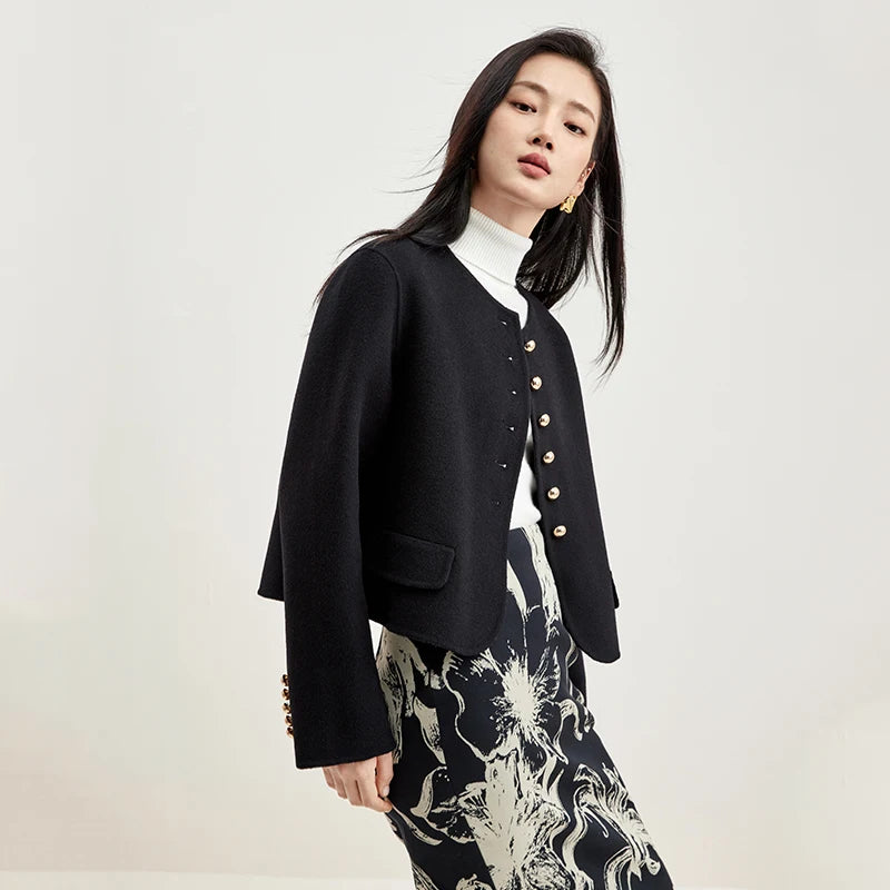 Women's collarless double-sided wool jacket in Midnight Sax color, with sculptural golden buttons and hand-finished seams. — From Borcelleclothes.