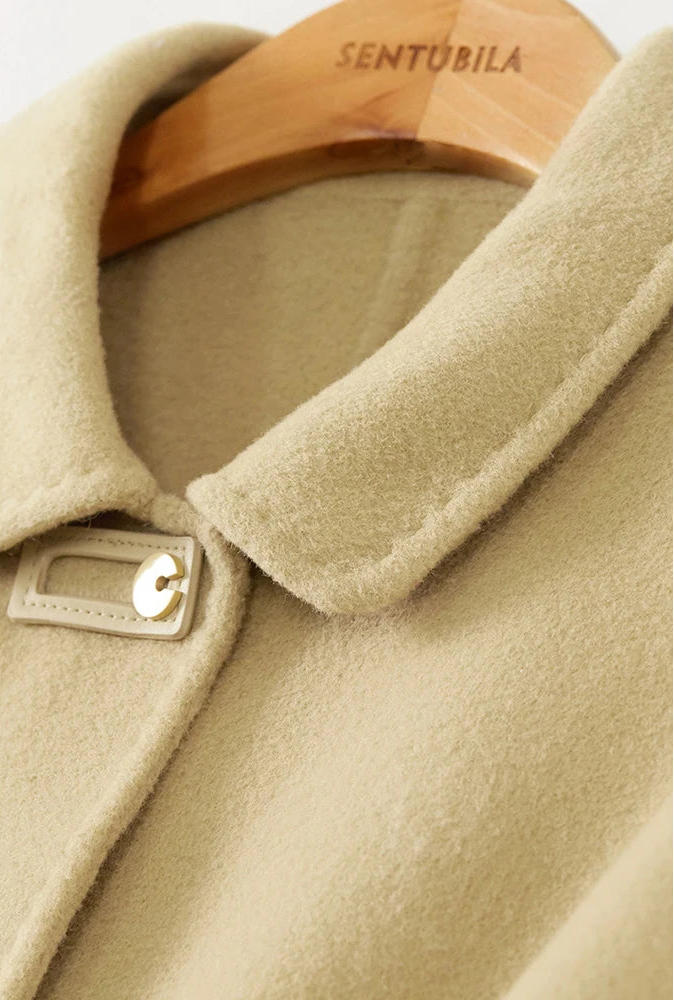 Close-up of the pointed collar on a women's wool jacket with graphic loop detail — From Borcelleclothes.