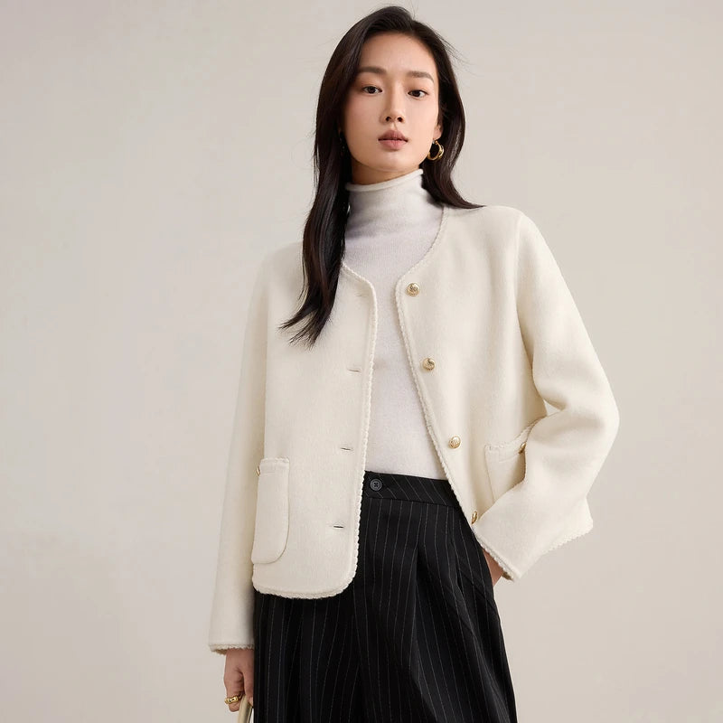 Women's double-sided virgin wool jacket in Tumbled Shell. Features include gold-tone embossed buttons, patch pockets, and hand-made Wave Stitch finishing along the edges. — From Borcelleclothes.