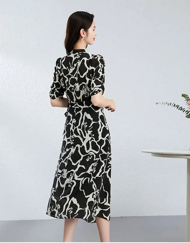 The clean, architectural back of the silk dress, where the "Rorschach" inkblots create a mysterious, shifting landscape of black and white. — From Borcelleclothes.